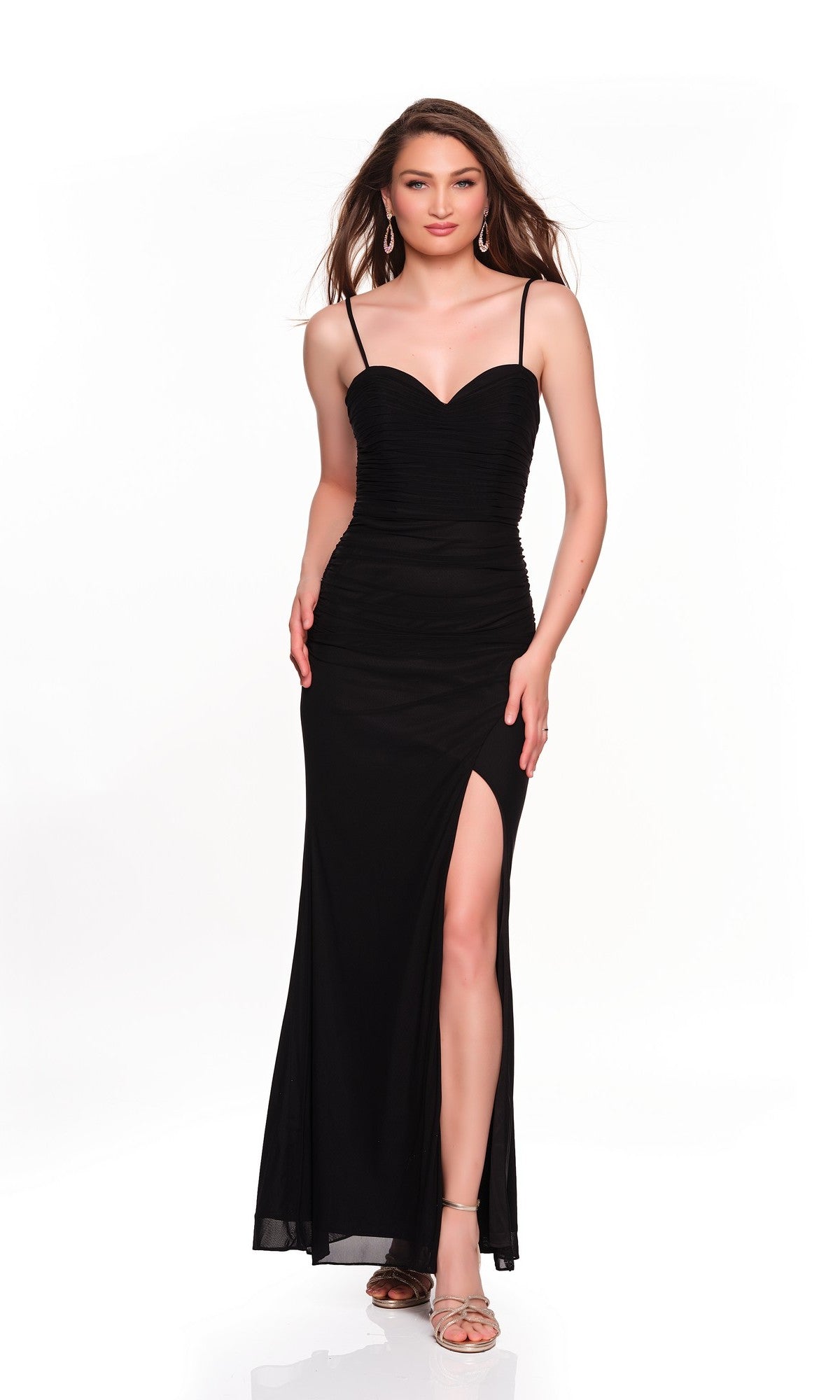 A woman models the Dave and Johnny 12849 long prom dress, featuring fitted ruched mesh, thin straps, a sweetheart neckline, and a thigh-high slit against a plain white background.